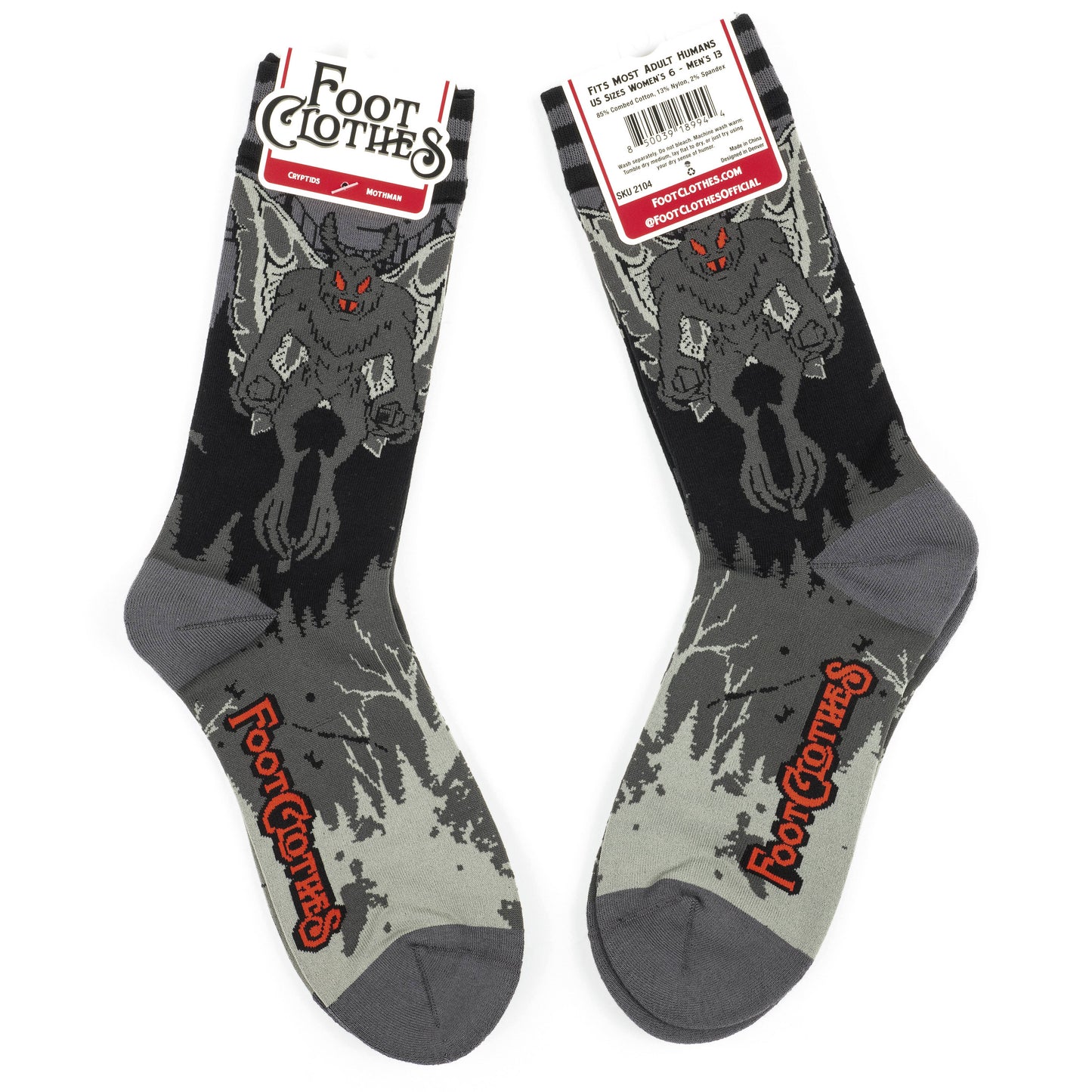 A pair of socks featuring Mothman. Grey legs, grey heel, toe and cuff.
