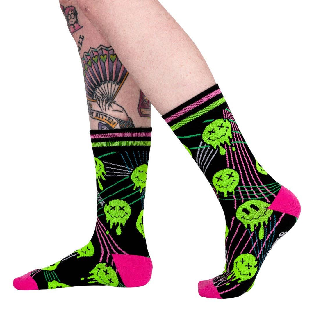 Laser Bass Face Melt Supreme Socks. A pair of socks featuring glow in the dark melting smiley faces.