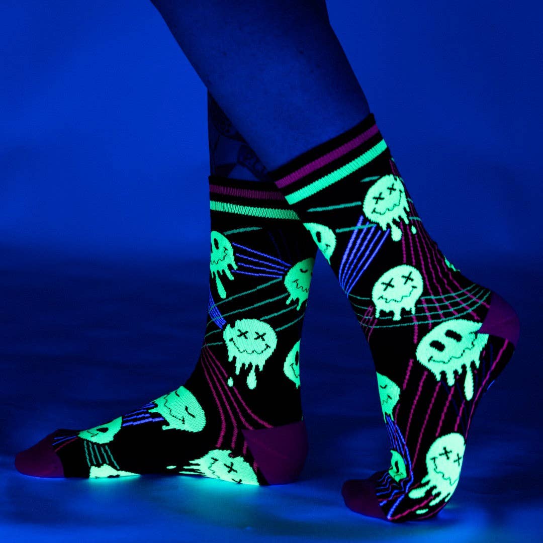Laser Bass Face Melt Supreme Socks. A pair of socks featuring glow in the dark melting smiley faces.
