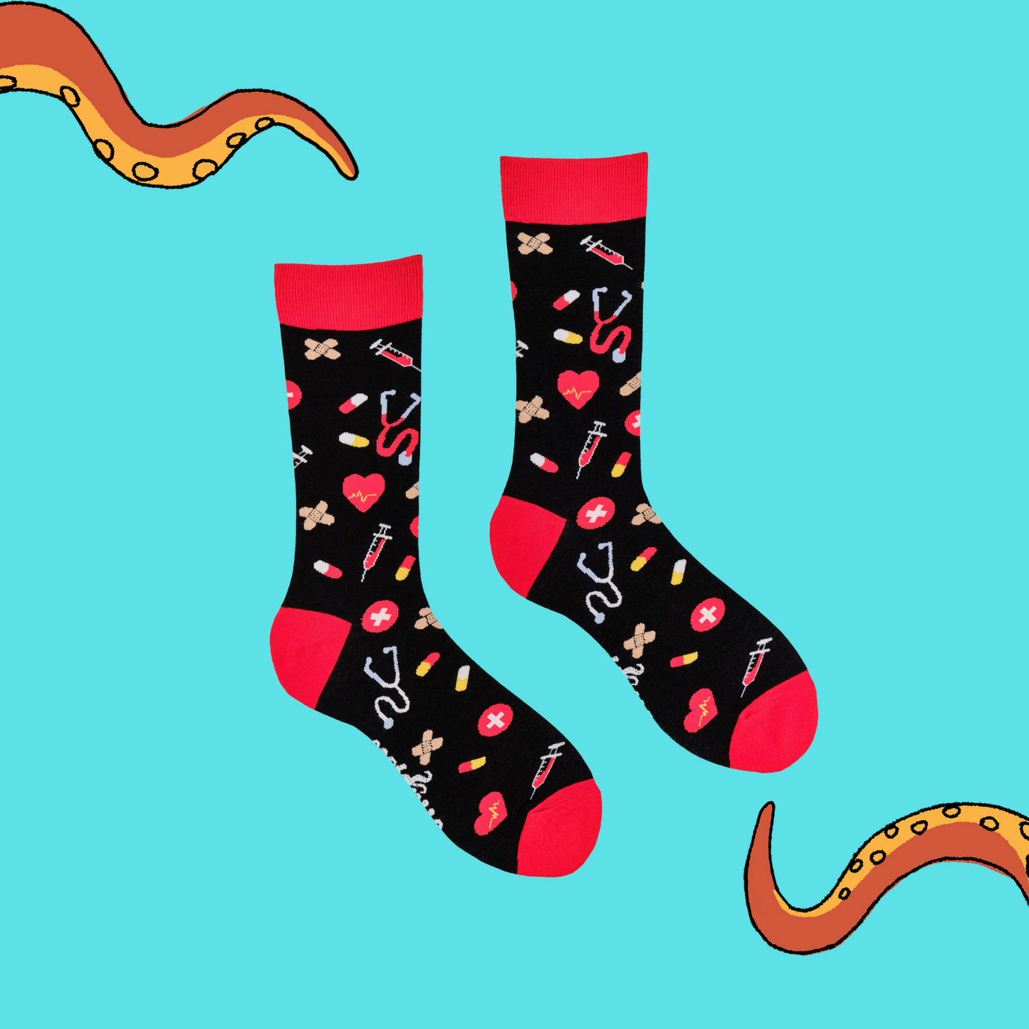 A pair of socks depicting medical equipment and symbols. Black legs, red cuff, heel and toe.