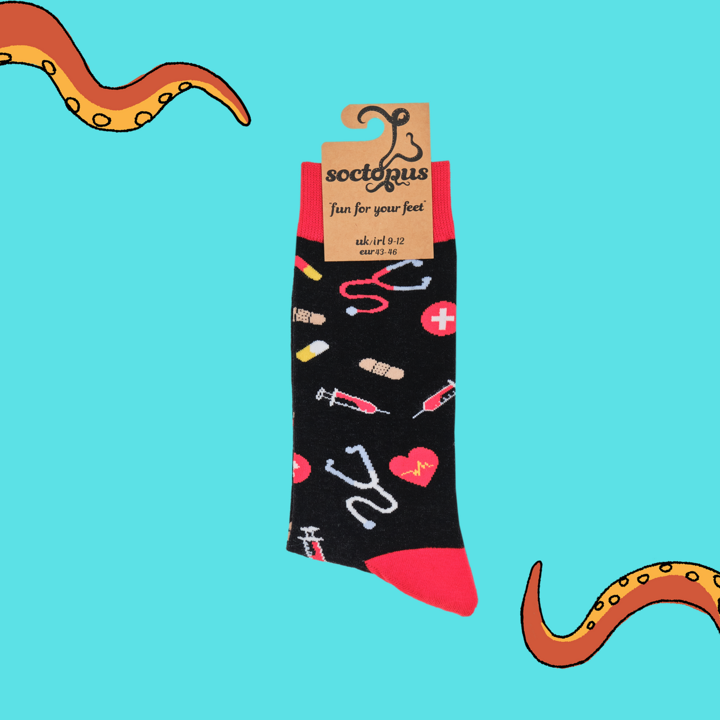 A pair of socks depicting medical equipment and symbols. Black legs, red cuff, heel and toe. In Soctopus Packaging.