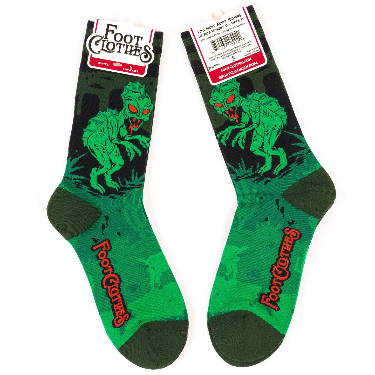 A pair of socks featuring El Chupacabra. Green legs, heel, toe and cuff.