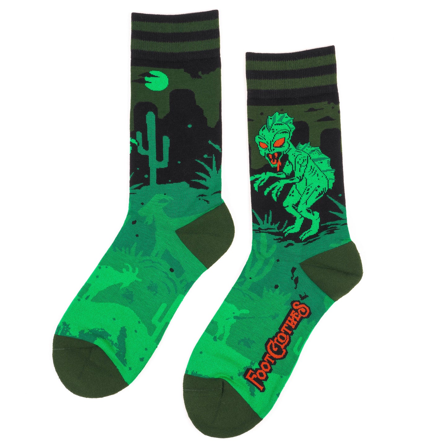 A pair of socks featuring El Chupacabra. Green legs, heel, toe and cuff.