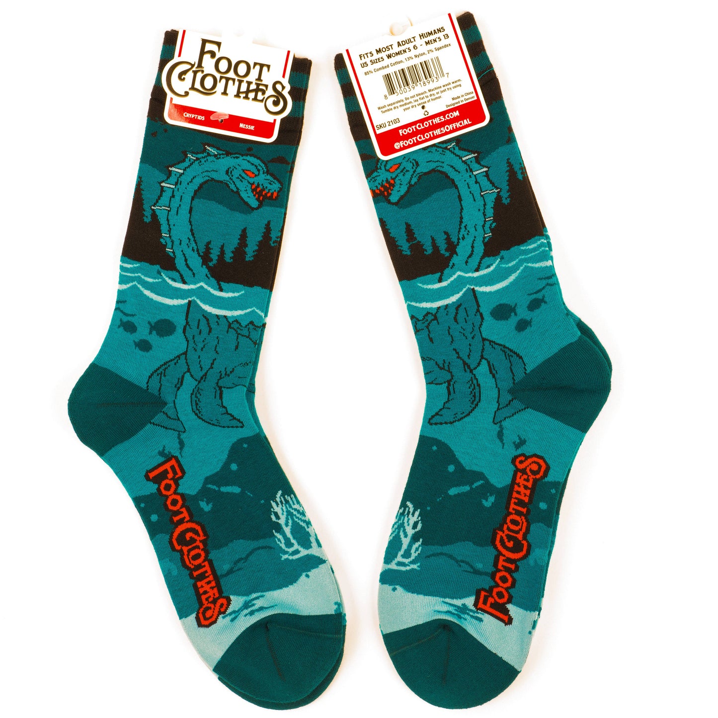 A pair of socks featuring the Loch Ness Monster. Blue legs, blue heel, toe and cuff.