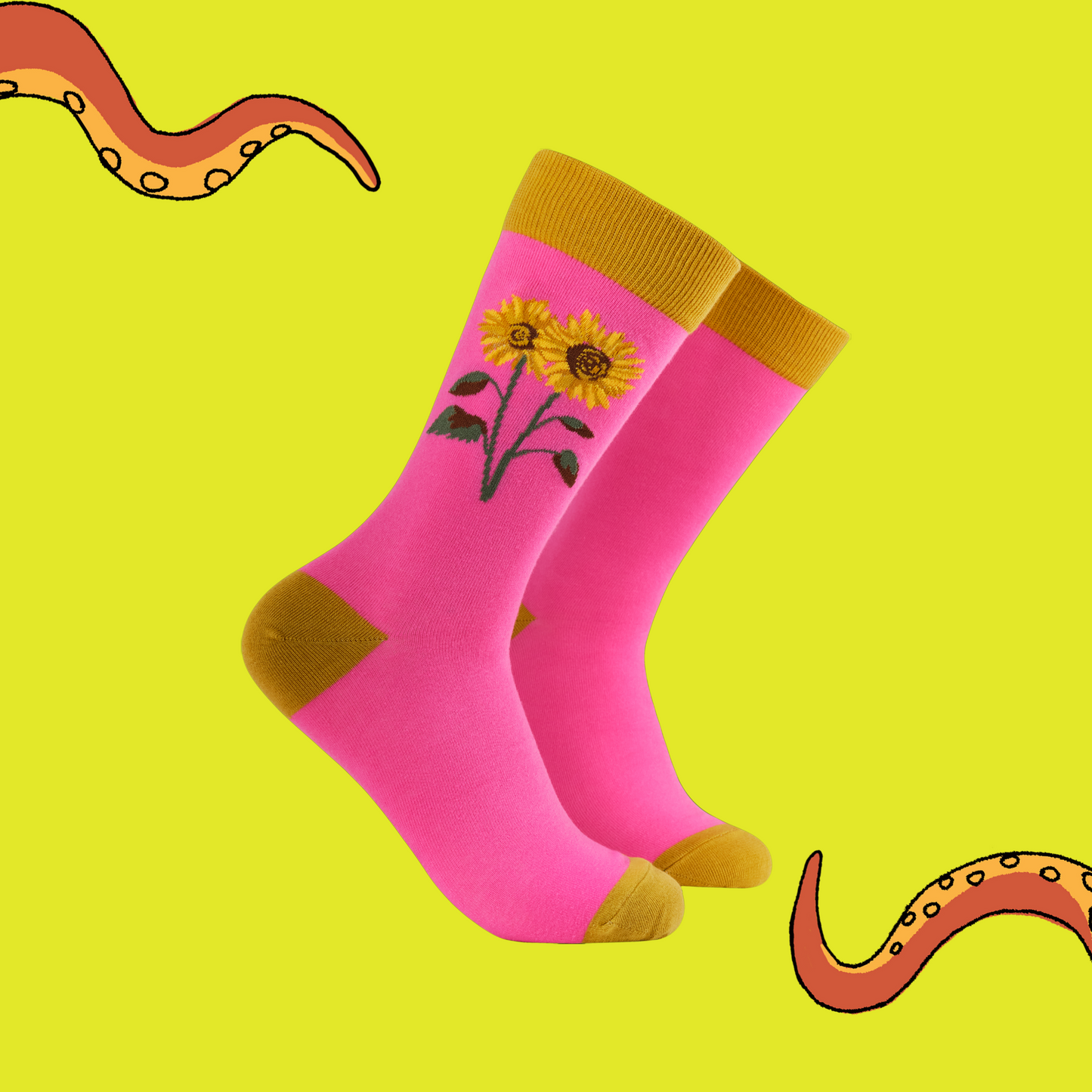 Pink socks with sunflower design on a yellow background