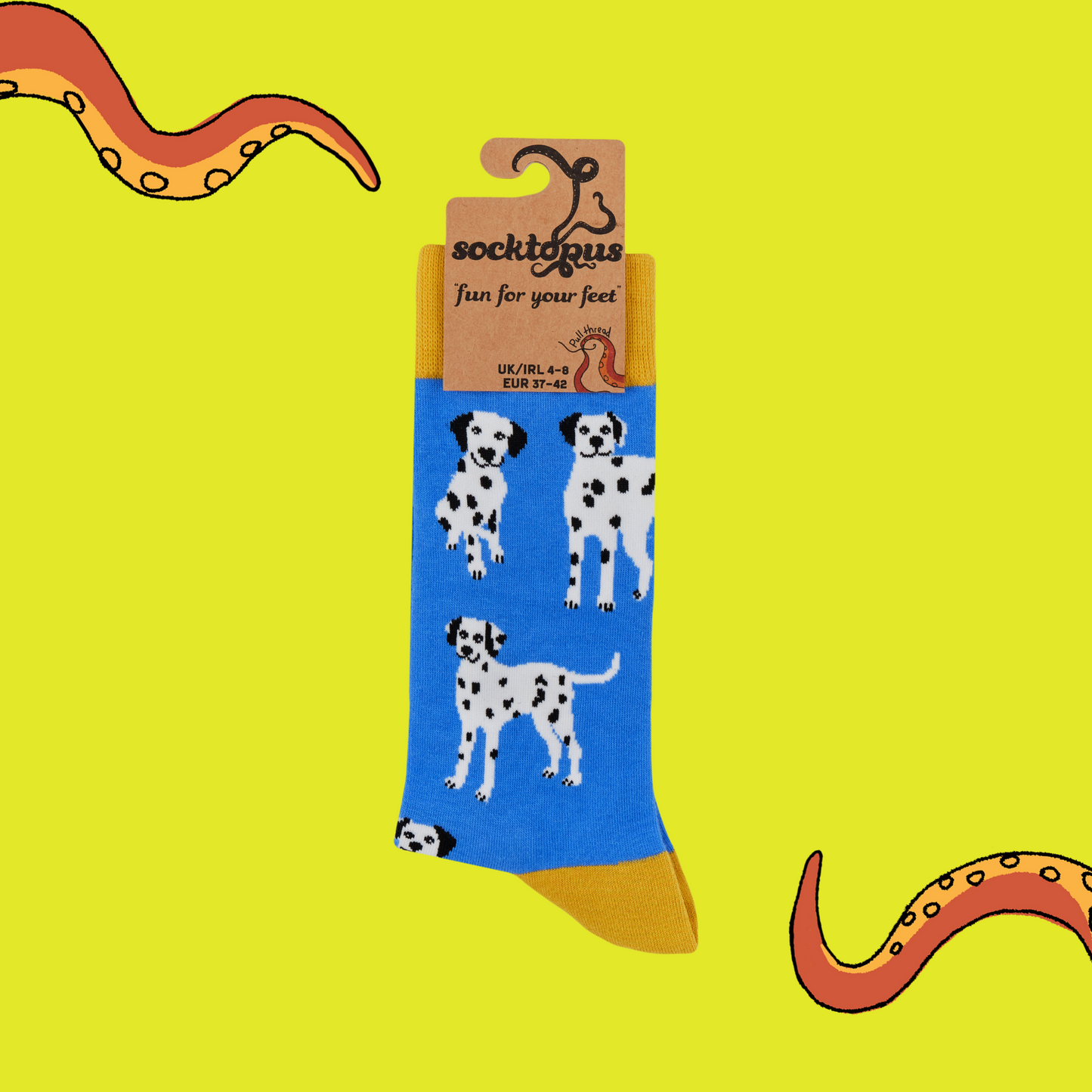 A pair of socks with a dalmatian motif. Blue legs, yellow heel, toe and cuff.