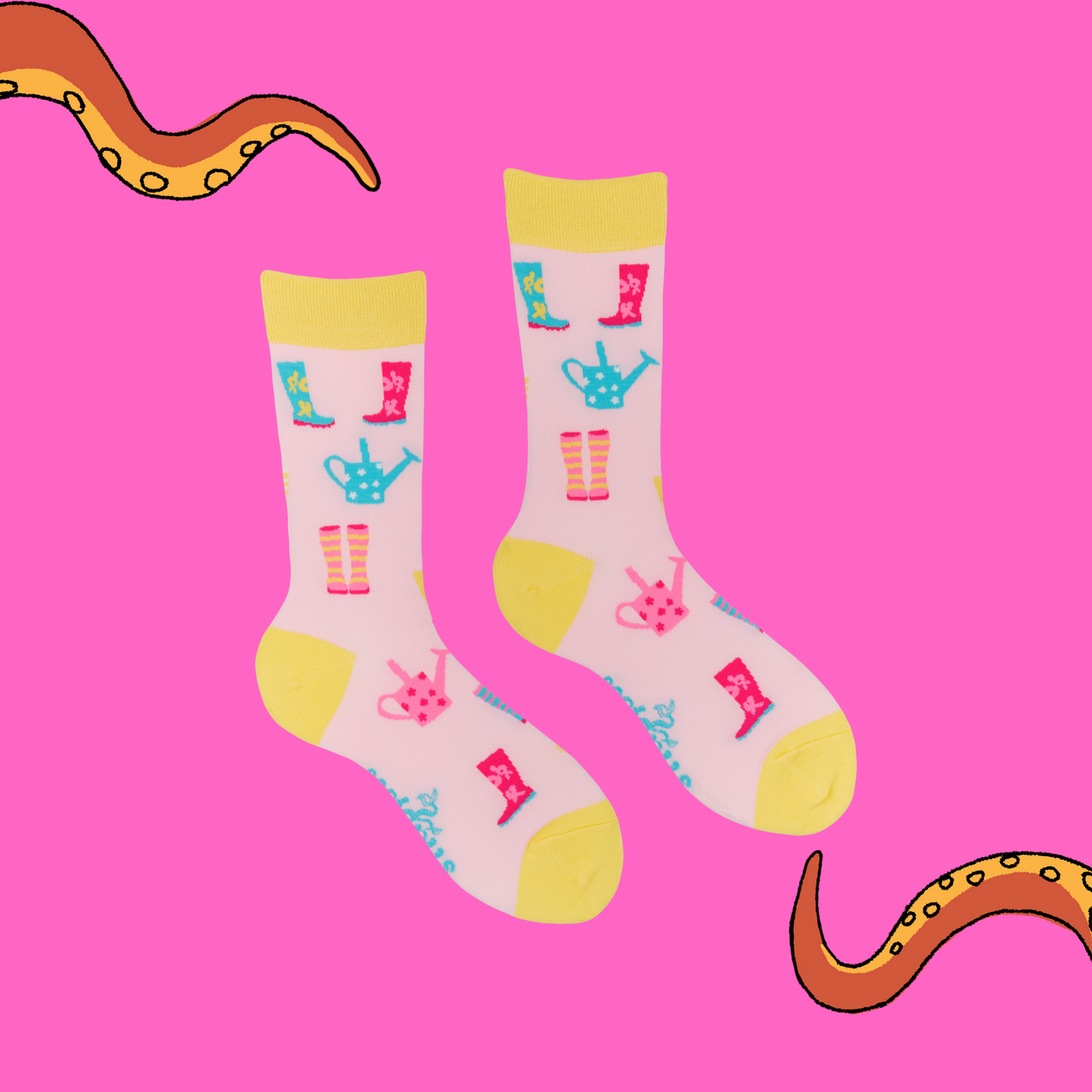A pair of socks featuring a playful wellies motif. Pink legs, yellow heel, toe and cuff.