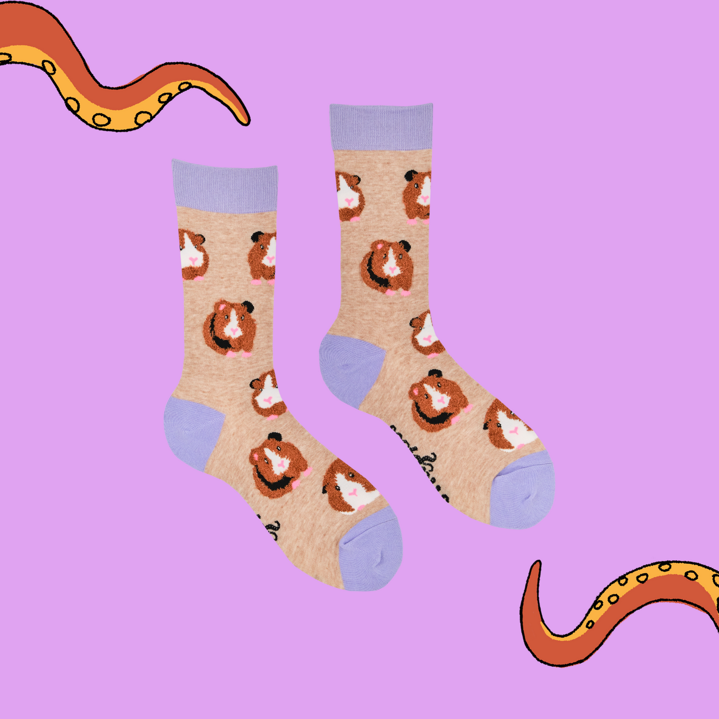 A pair of socks with fluffy guinea pigs. Brown legs, purple heel, toe and cuff.