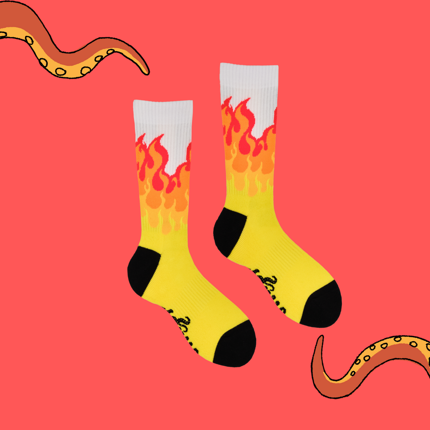 A pair of socks depicting rising flames. Yellow legs, white cuff, black heel and toe.