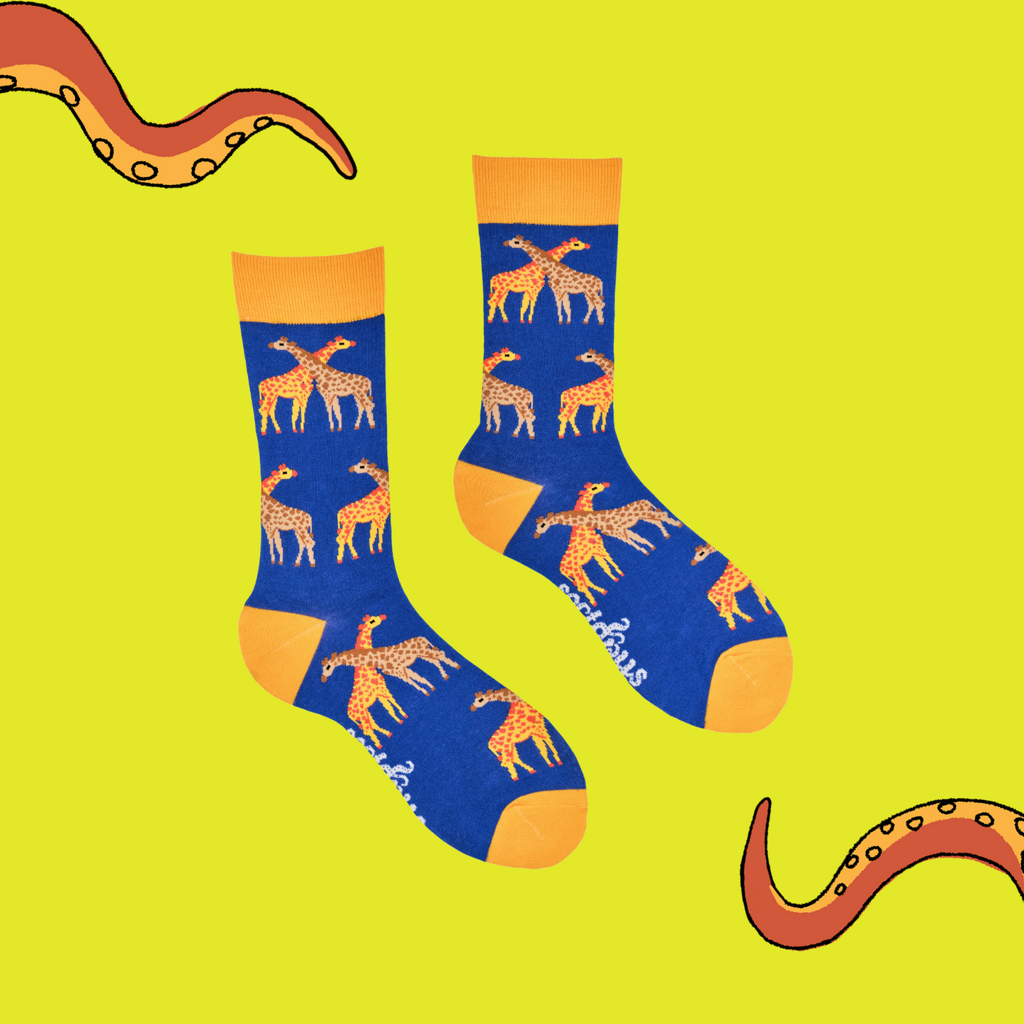 A pair of socks depicting giraffes. Royal blue legs, yellow cuff, heel and toe.