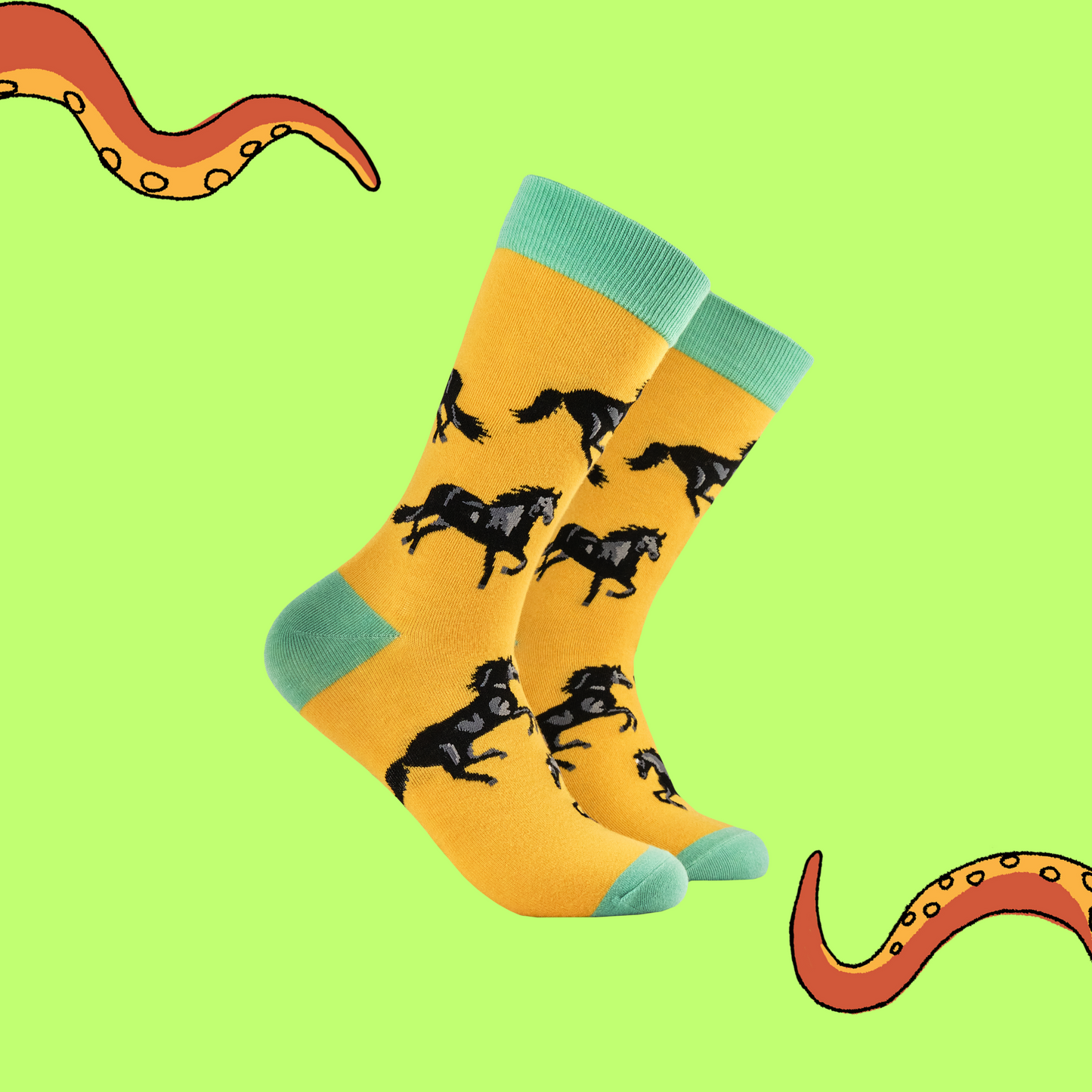 A pair of socks with a black stallion motif. Yellow legs, green heel toe and cuff.