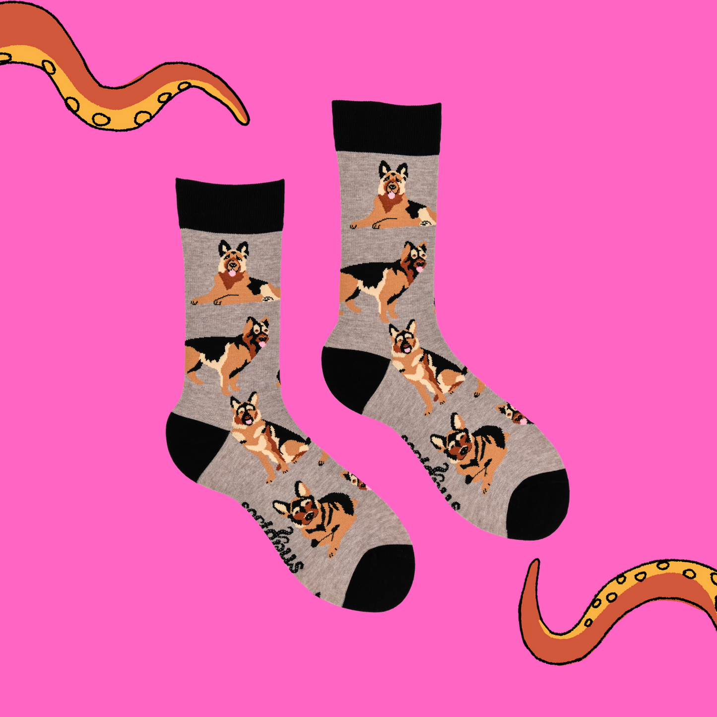 A pair of socks depicting German Shepherd dogs. Grey legs, black cuff, heel and toe.