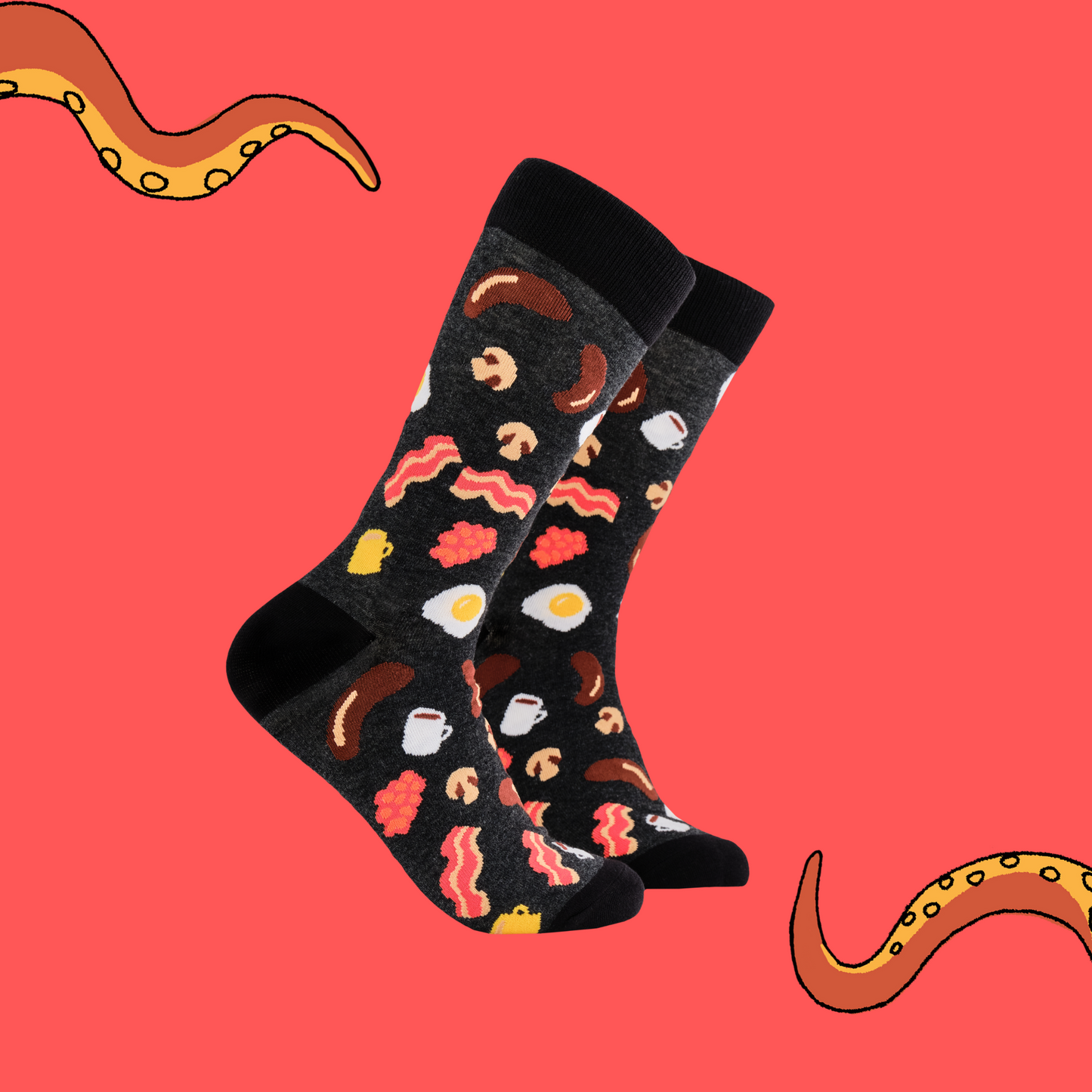 A pair of socks depicting English breakfast ingredients. Grey legs, black cuff, heel and toe.