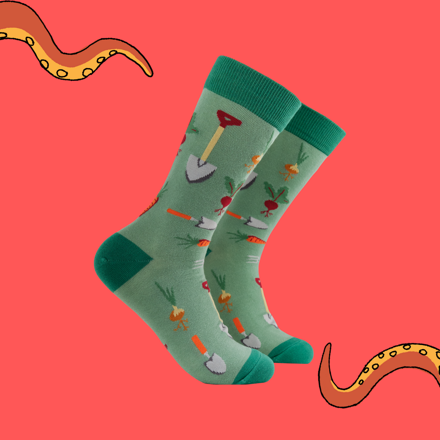 A pair of socks with a gardening motif. Green legs, heel, toe and cuff.