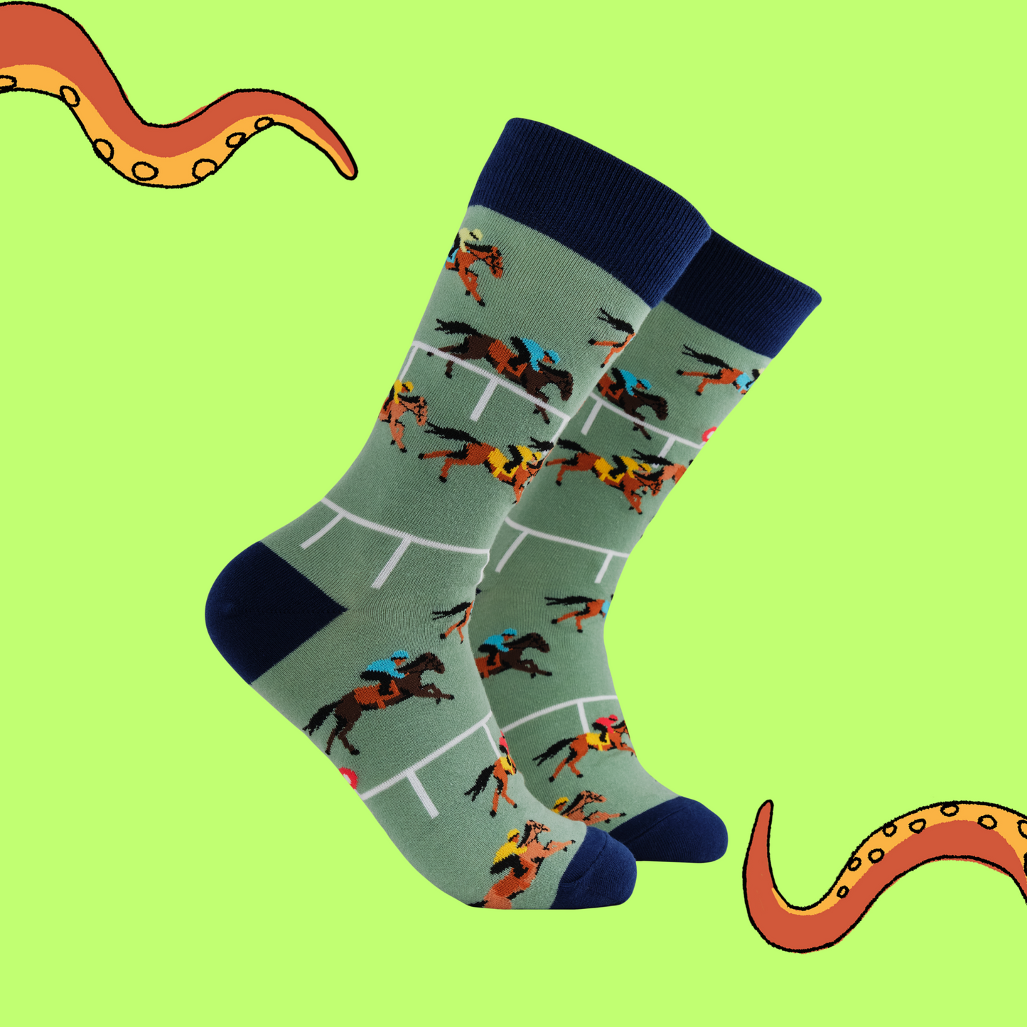 A pair of socks depicting horse racing. Green legs, black cuff, heel and toe.