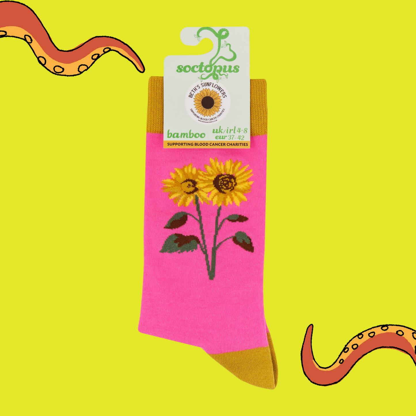 Pink sock with sunflower design and label on yellow background