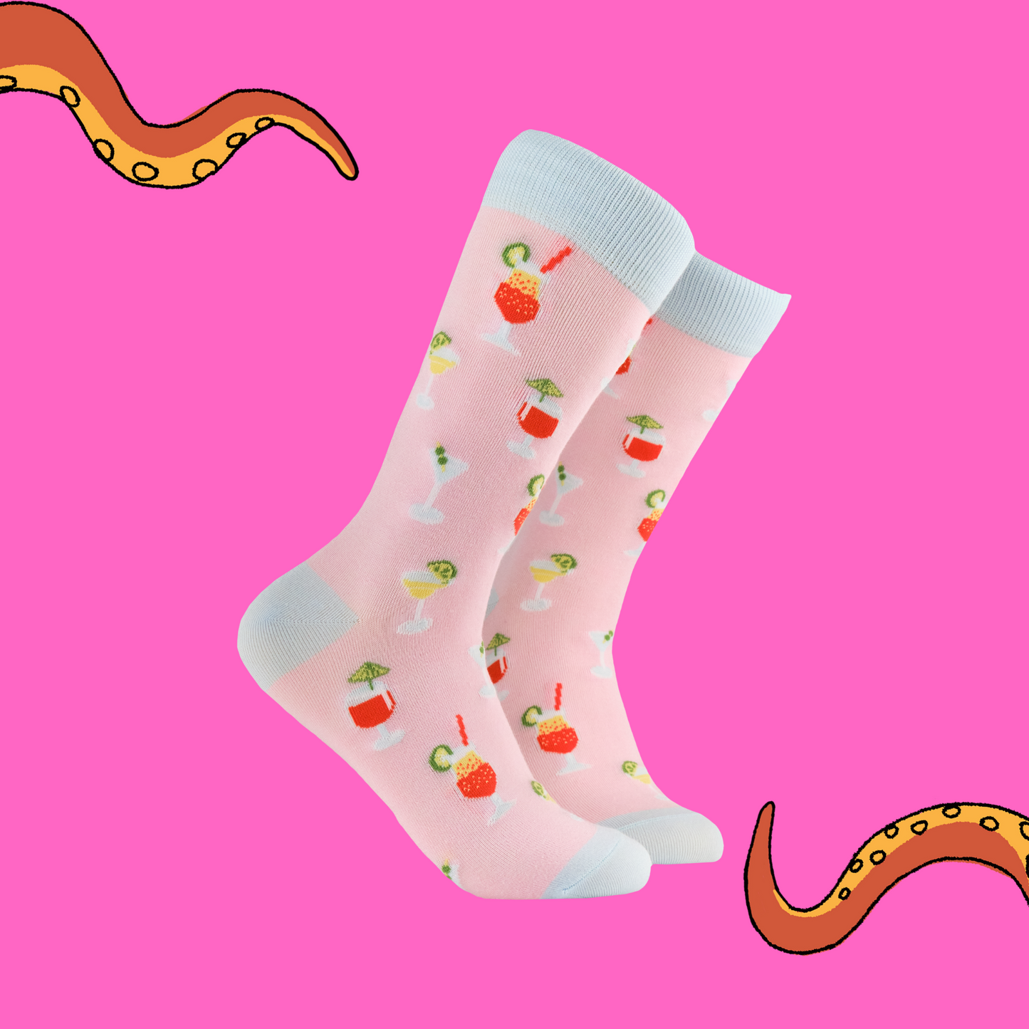 A pair of socks with a cocktail motif. Pink legs, light blue heel toe and cuff.