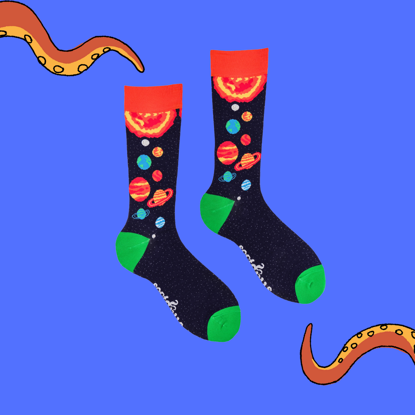 A pair of socks depicting planets and stars. Purple legs, orange cuff, green heel and toe.