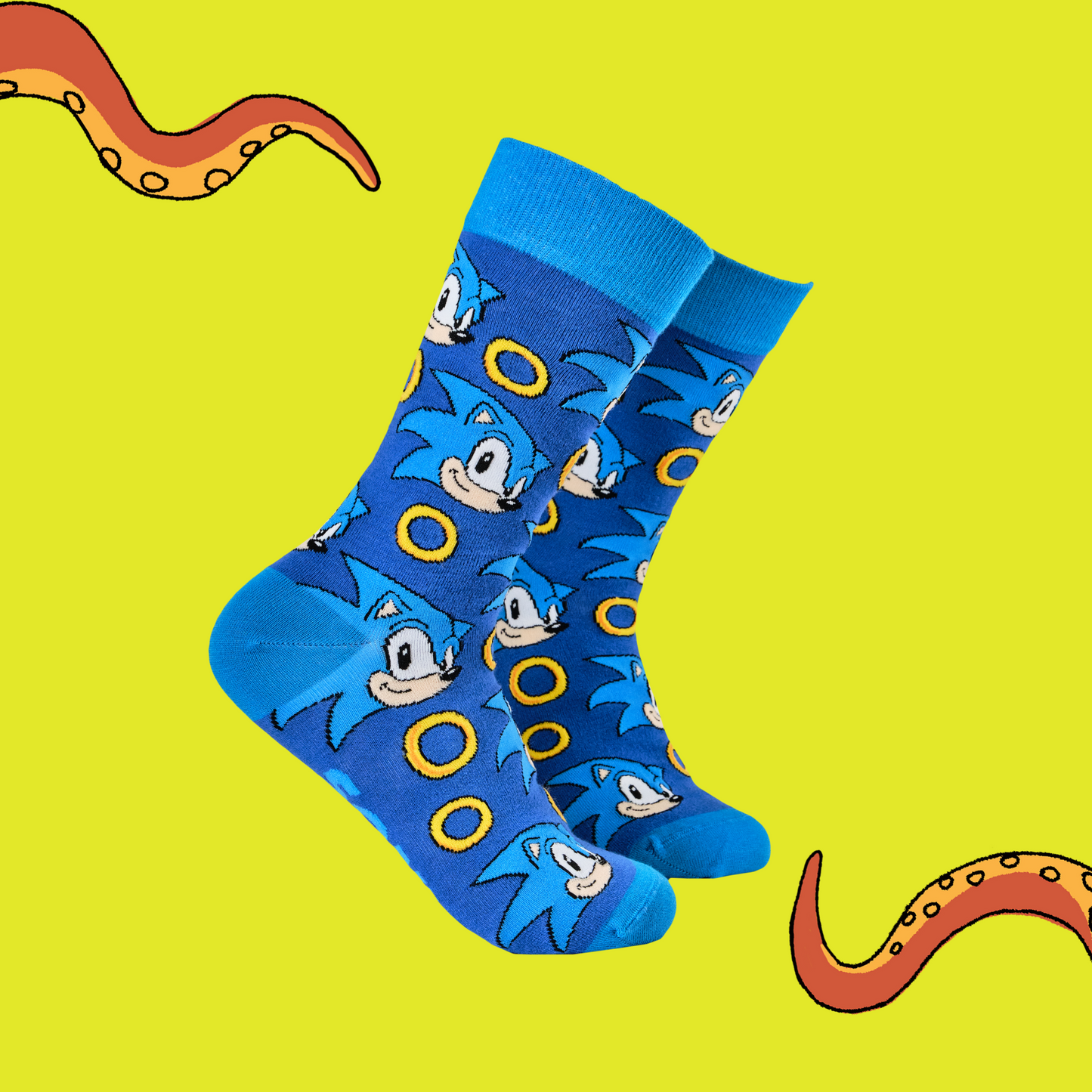 A pair of socks featuring Sonic with power rings. Dark blue legs, light blue heel, cuff and toe.