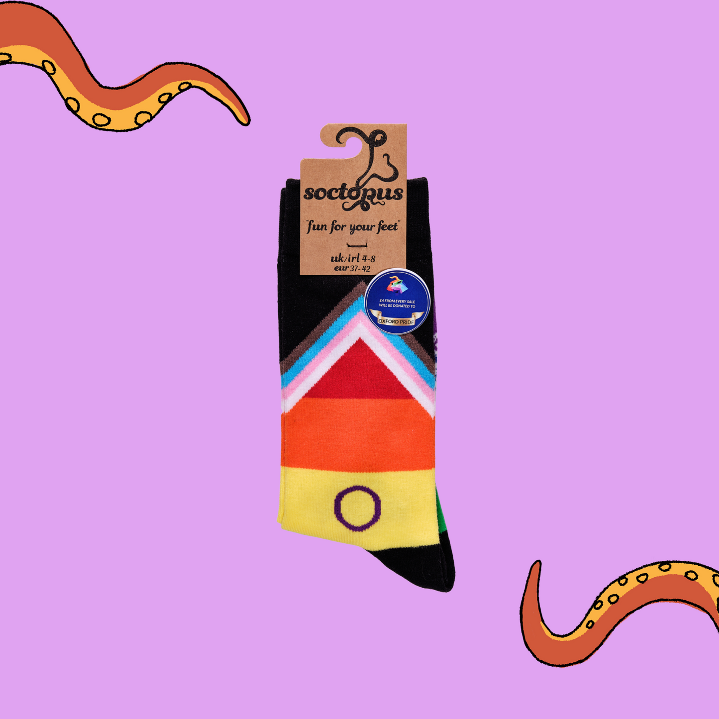 A pair of rainbow socks with an LGBTQ+ motif.