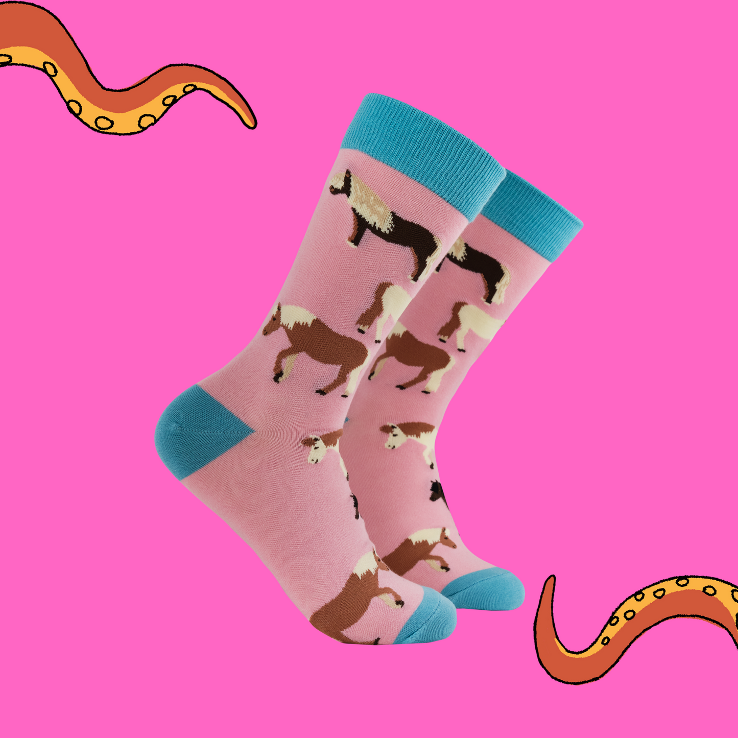 A pair of socks featuring cute ponies. Pink legs, blue heel, toe and cuff.