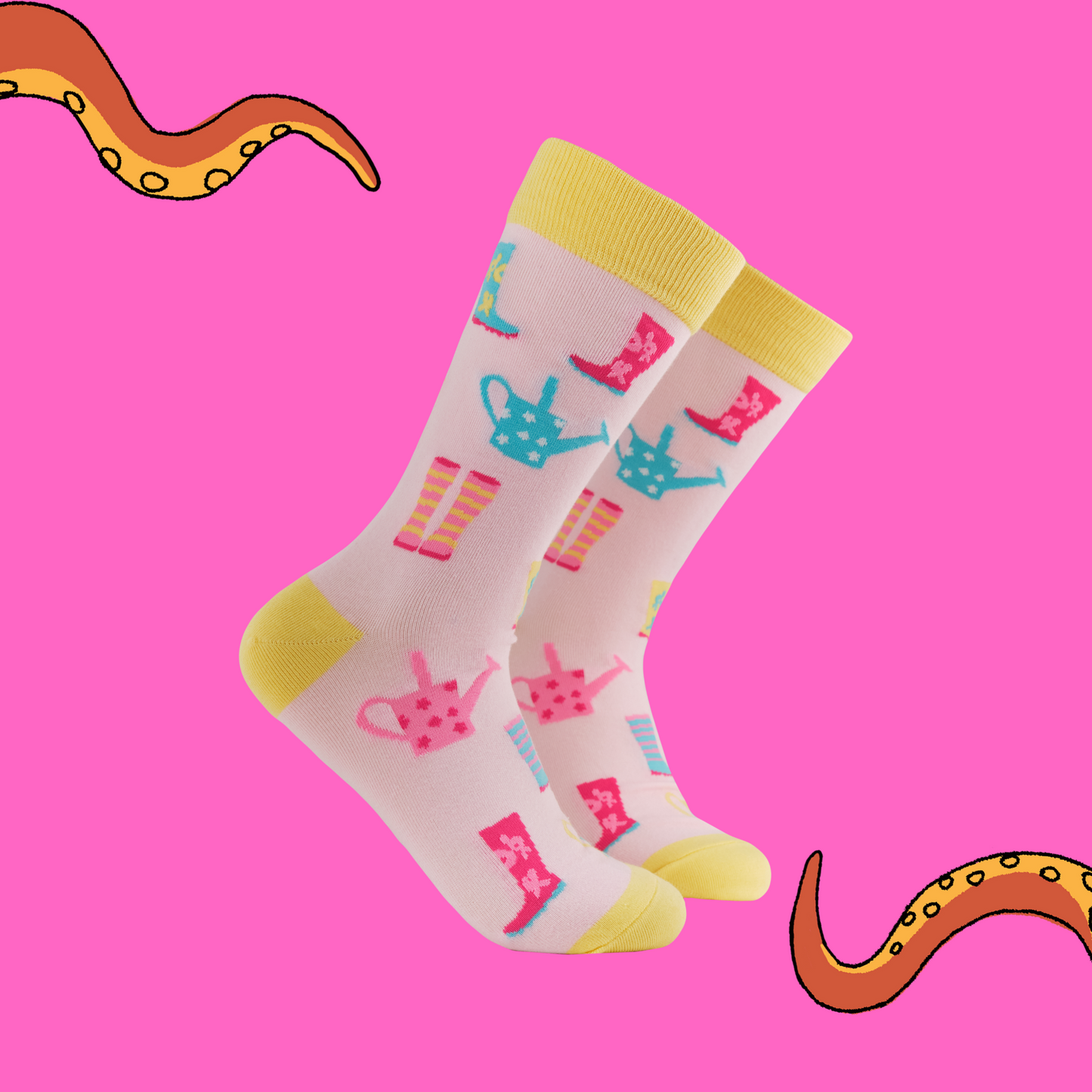 A pair of socks featuring a playful wellies motif. Pink legs, yellow heel, toe and cuff.