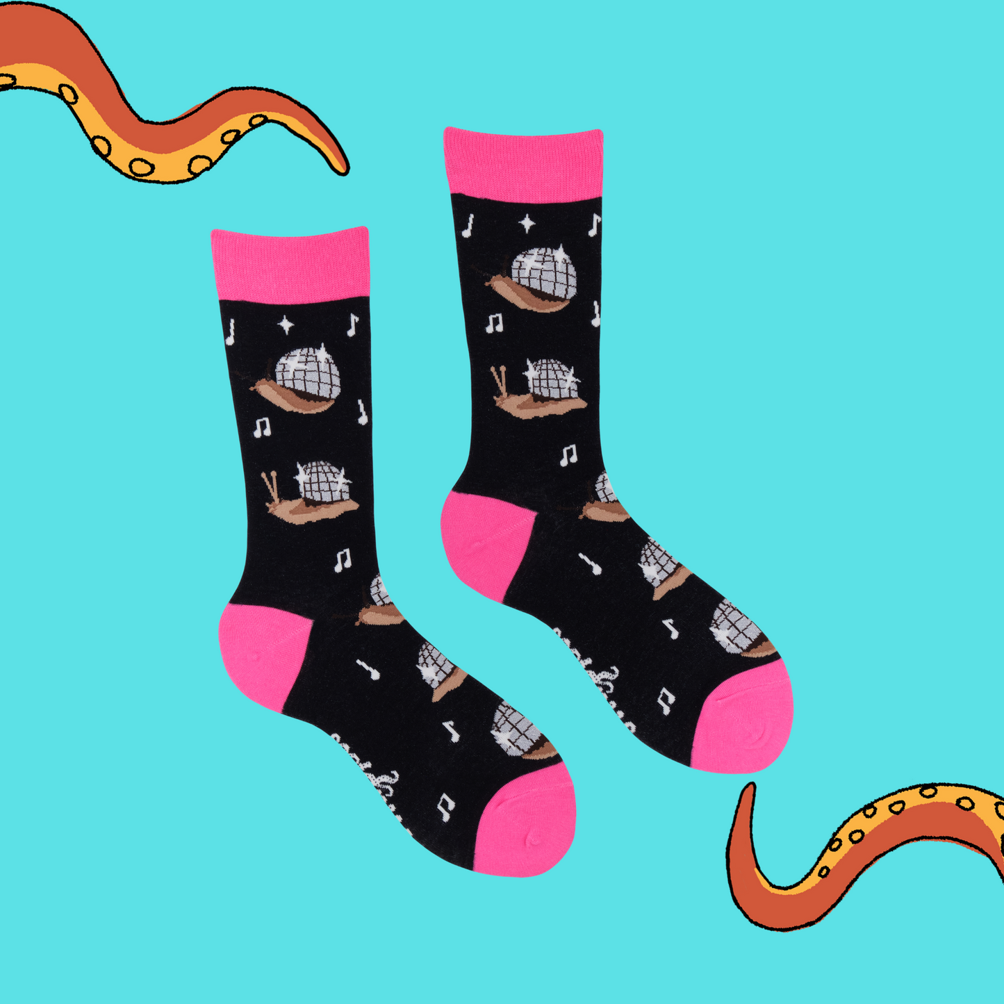 A pair of socks with a disco snail motif. Black legs, hot pink heel, toe and cuff.