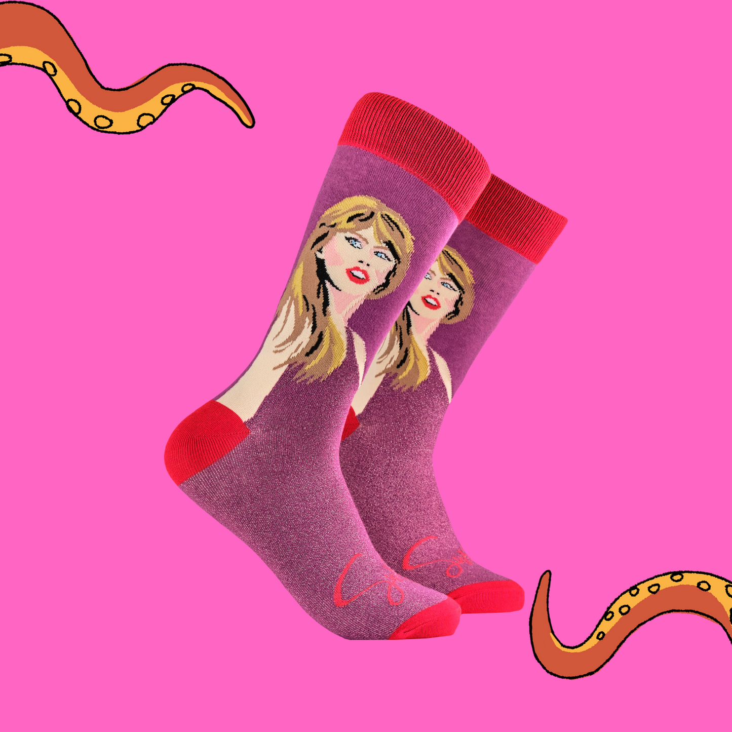 A pair of socks featuring Taylor Swift. Pink glittery legs, red heel toe and cuff.