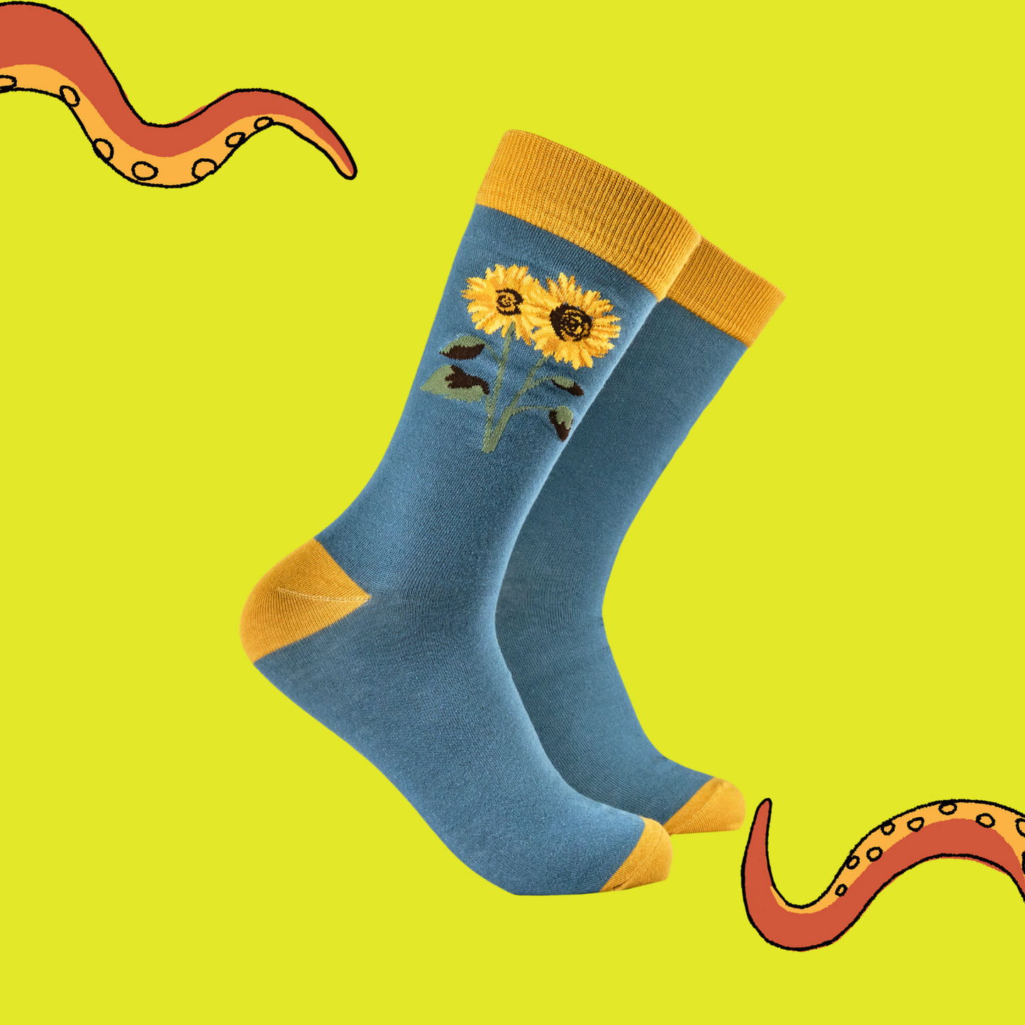 Blue socks with sunflower design on a yellow background
