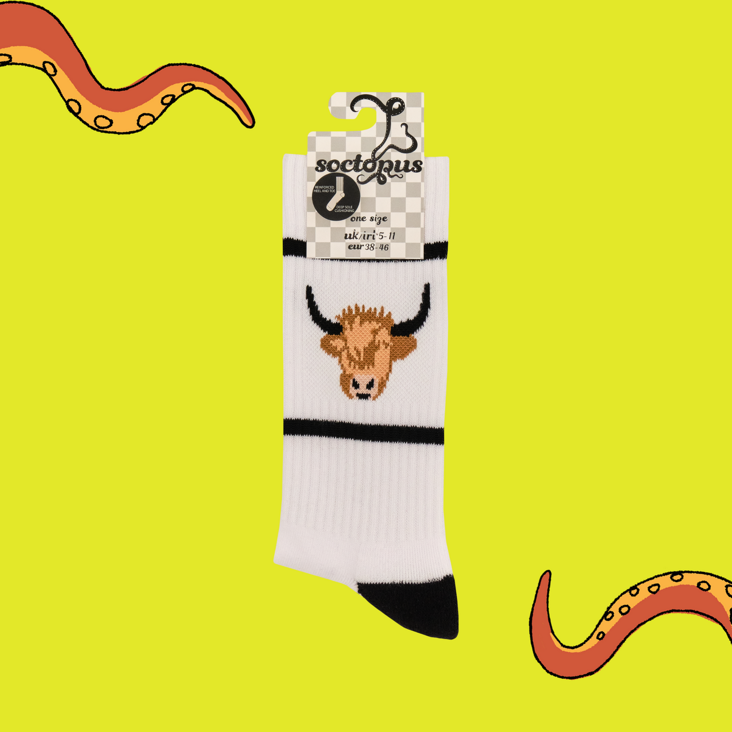 A pair of athletic style socks featuring a highland cow motif. White legs, black eel, toe and cuff.