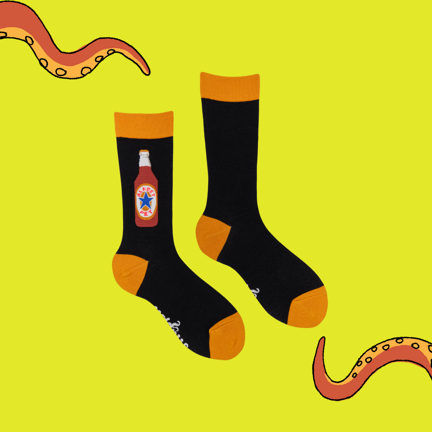 Alreet Pet Socks. A pair of black socks with a newcastle motif.