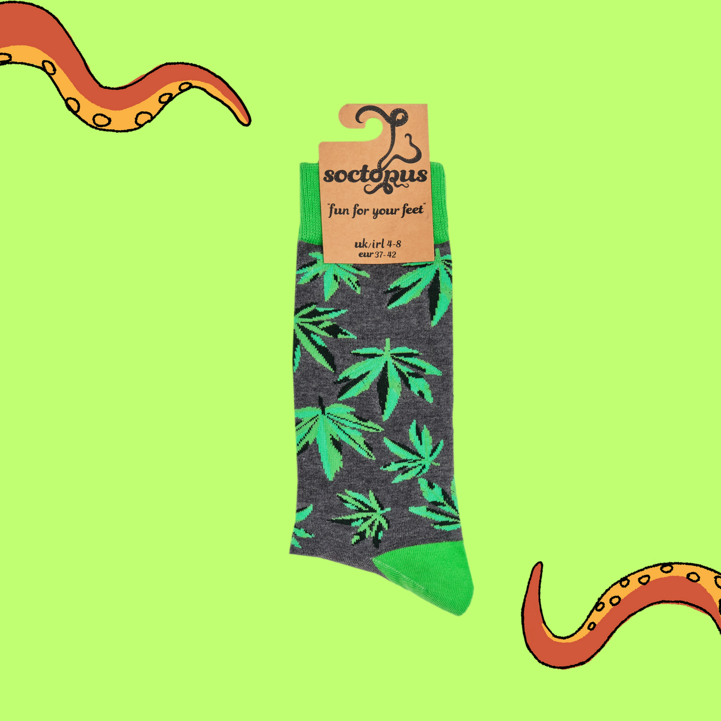 A pair of socks depicting cannabis leaves. Grey legs, bright cuff, heel and toe.