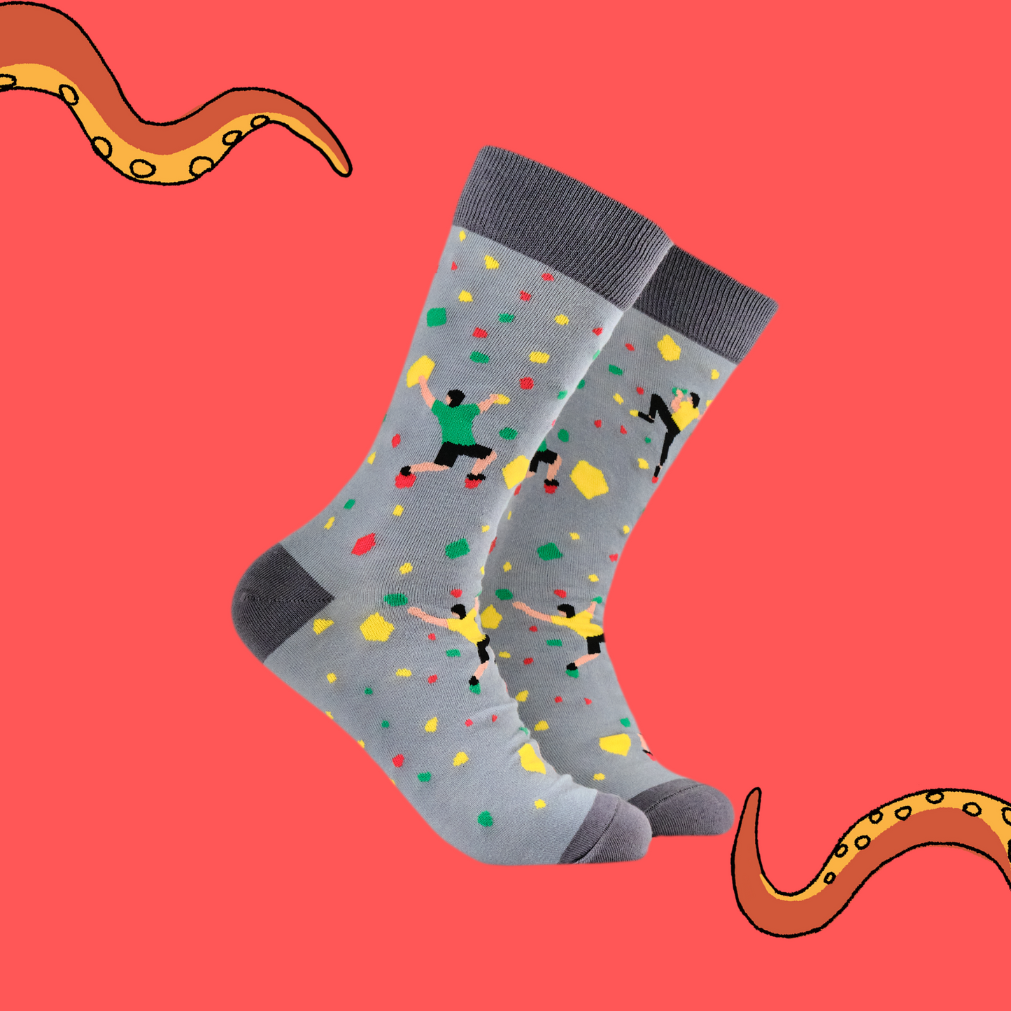 A pair of socks with a rock climbing motif. Grey legs, dark grey heel, toe and cuff.