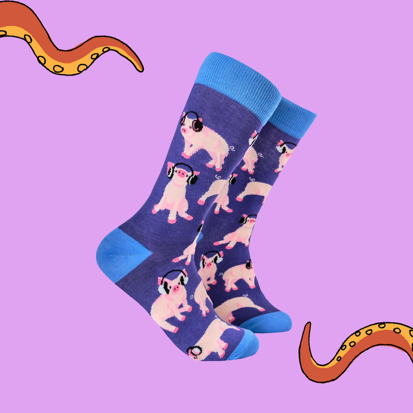 A pair of socks depicting Pigs being wearing headphones. GBlue legs, blue cuff, heel and toe.
