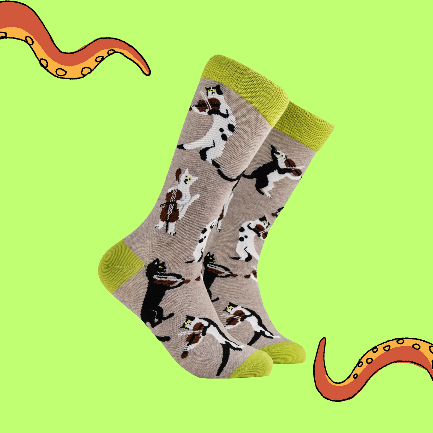 A pair of socks depicting cats playing string instruments. Grey legs, green heel toe and cuff.