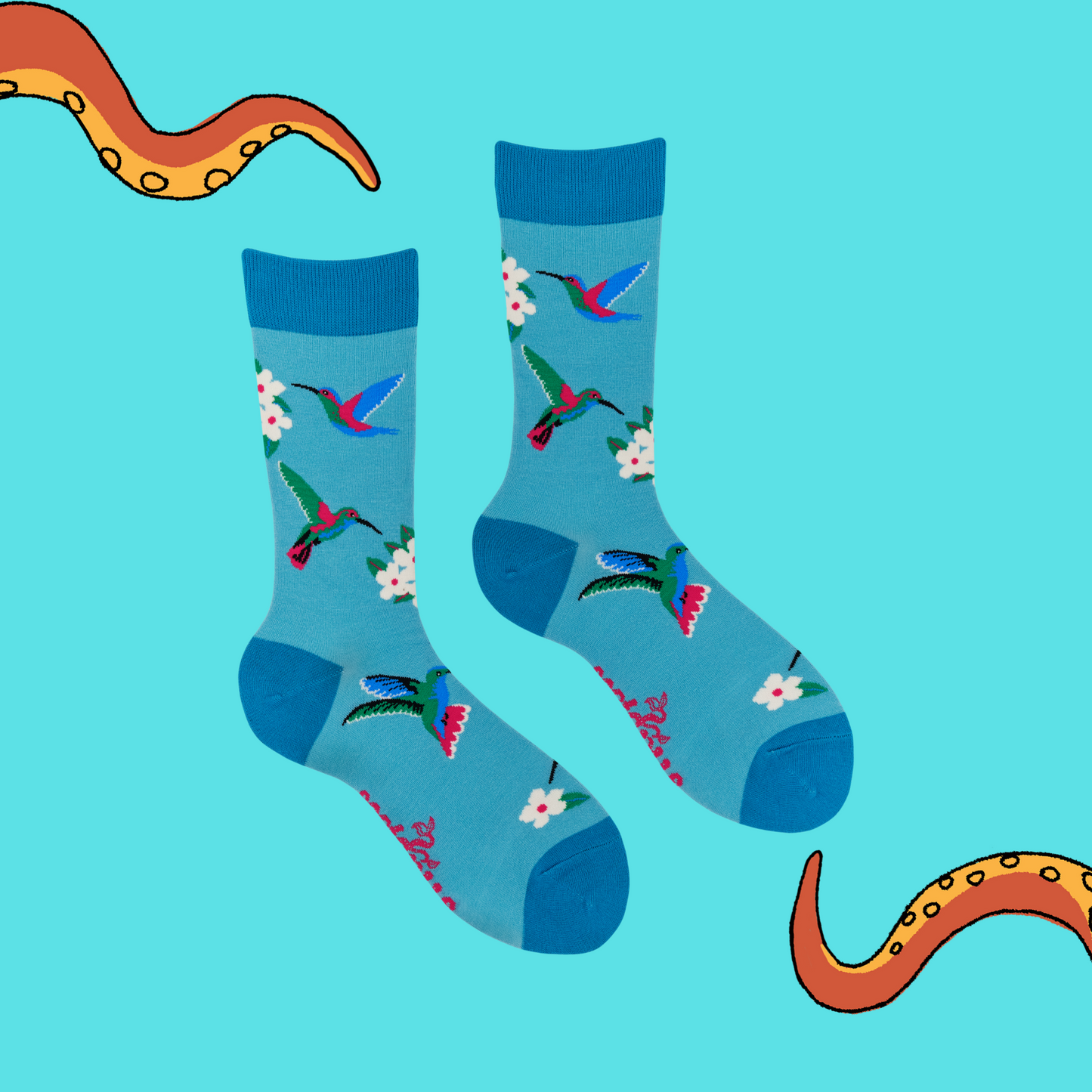 A pair of socks with a hummingbird motif. Blue legs, dark blue heel, toe and cuff.