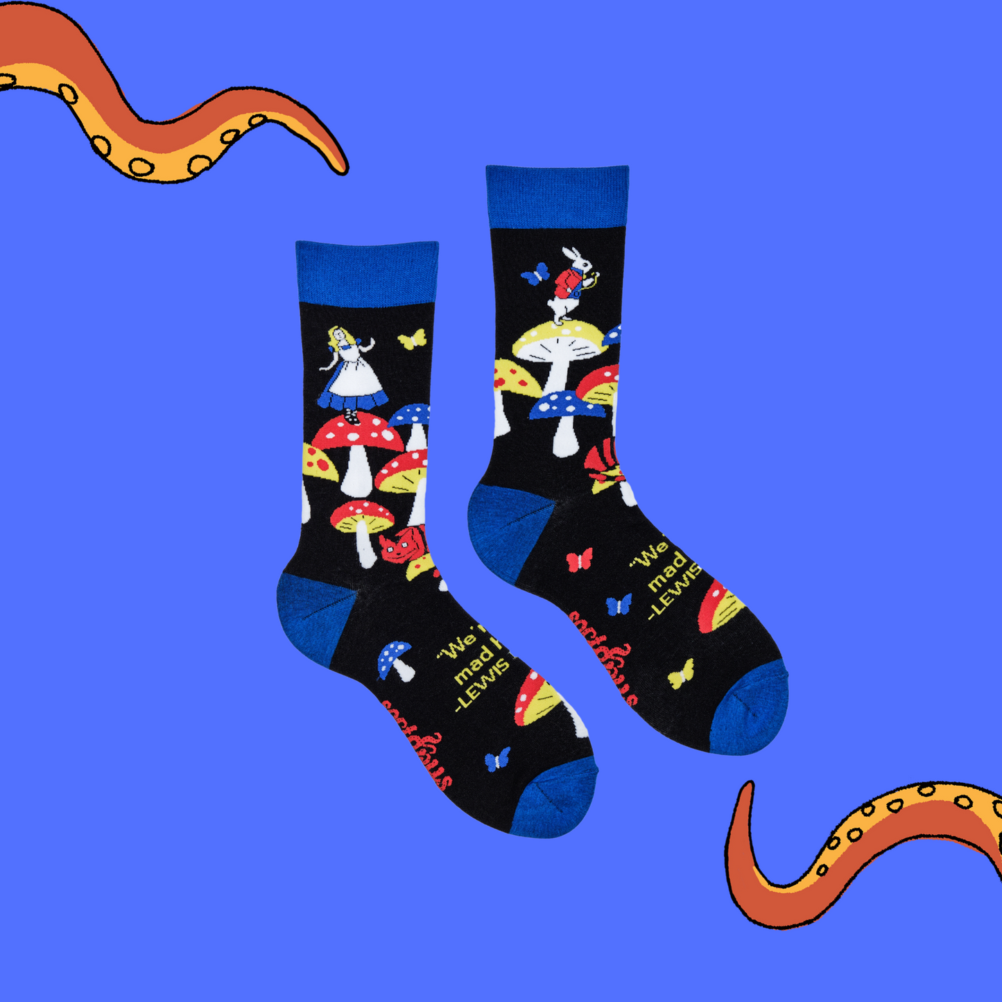 A pair of socks depicting Alice in wonderland and toadstools. Black legs, royal blue cuff, heel and toe.