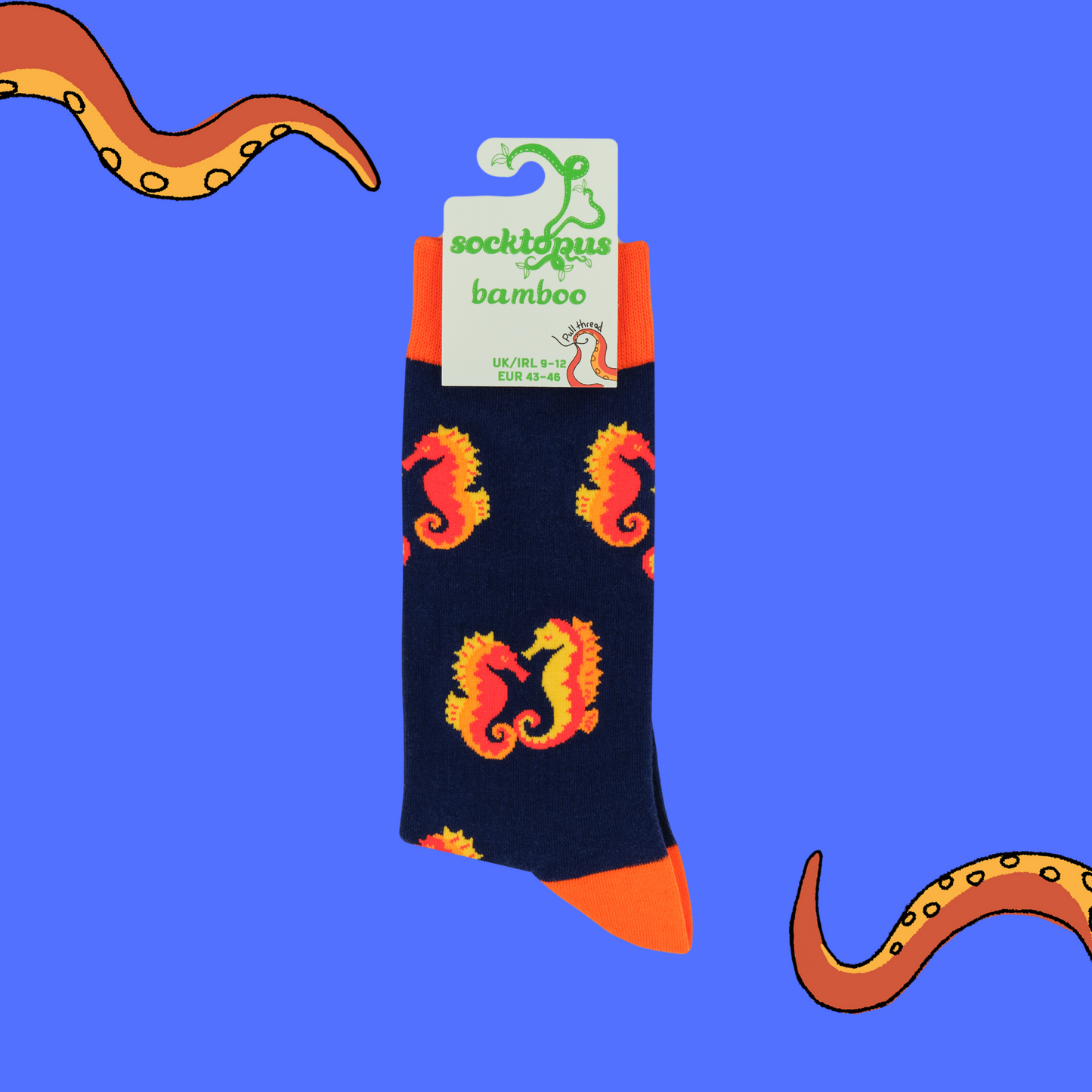 A pair of socks with a seahorse motif. Dark blue legs, red heel, toe and cuff.