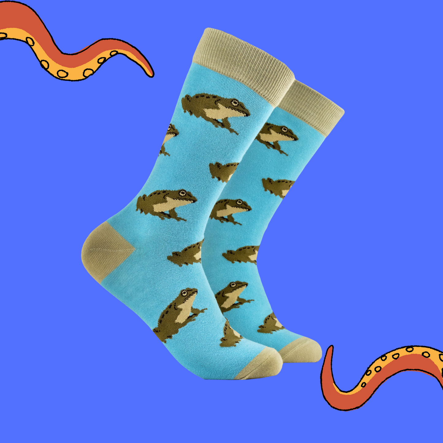 A pair of socks depicting frogs. Blue legs, brown heel, toe and cuff.