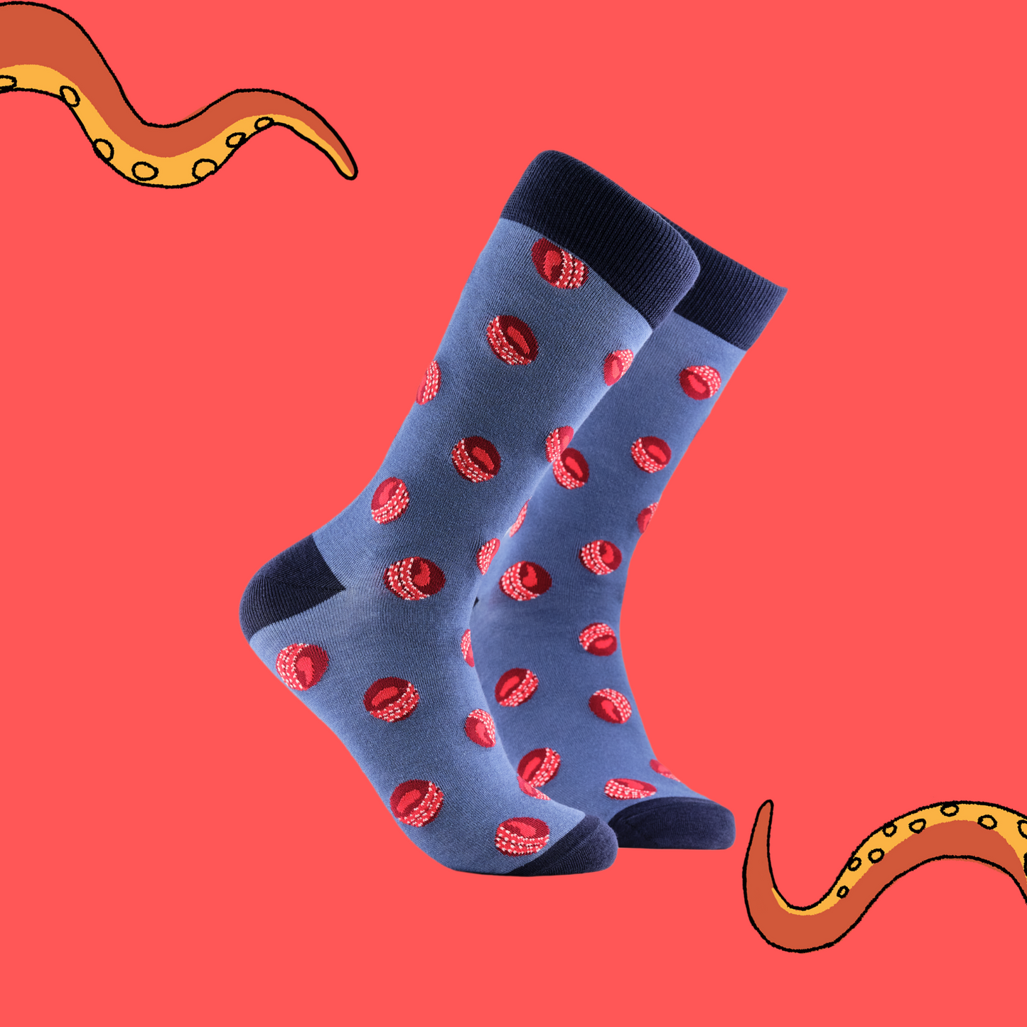 A pair of socks with a cricket ball pattern. Blue legs, dark blue cuff, heel and toe.