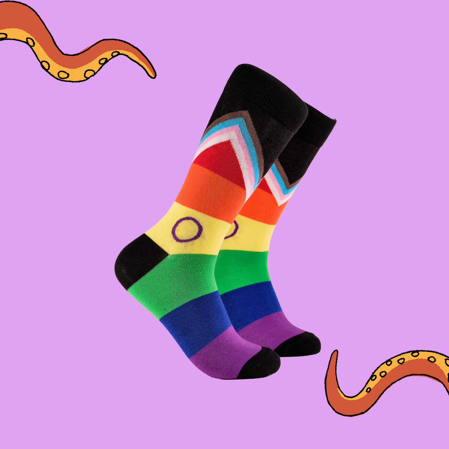 A pair of rainbow socks with an LGBTQ+ motif.