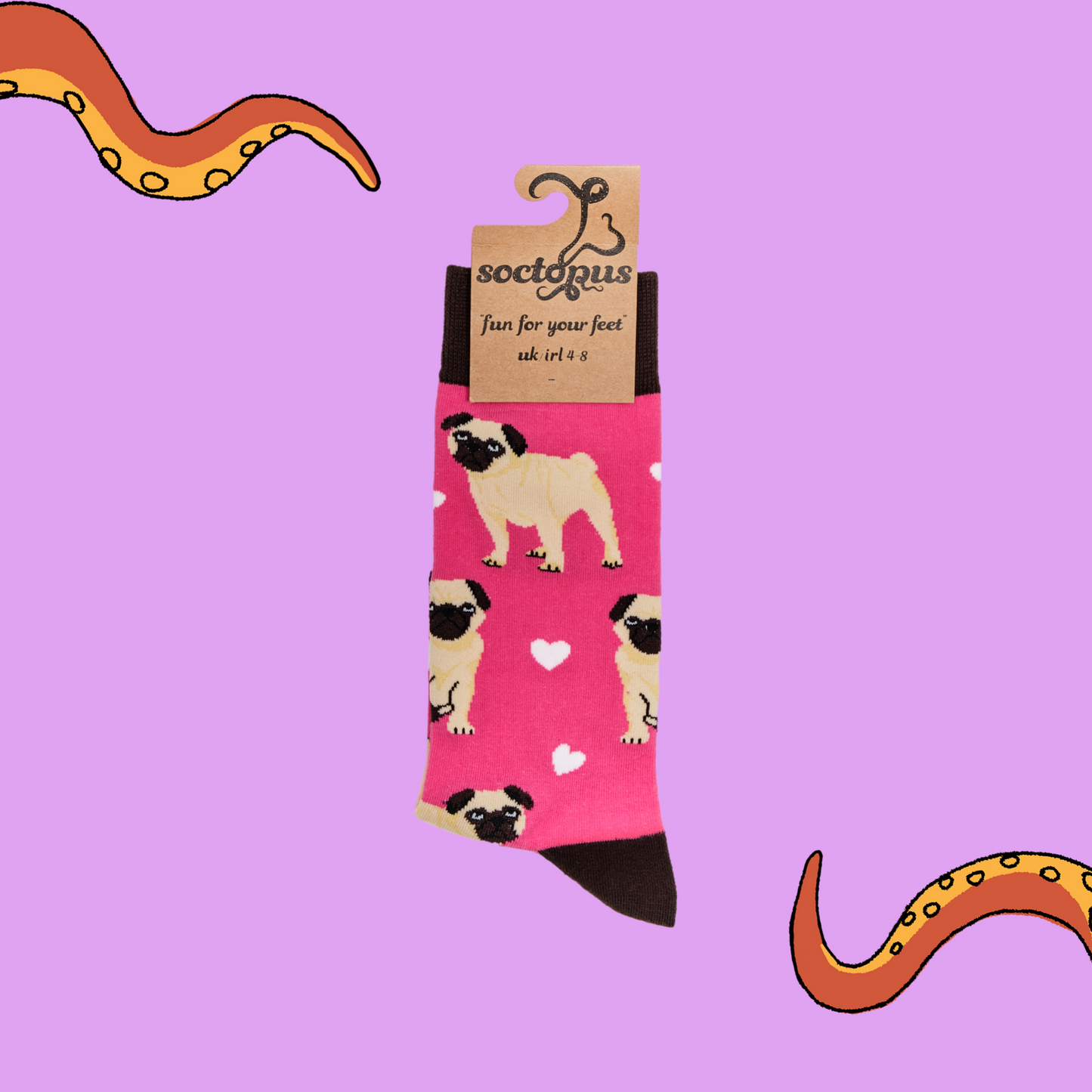 A pair of socks depicting hearts and pugs. Pink legs, brown cuff, heel and toe. In Soctopus Packaging.