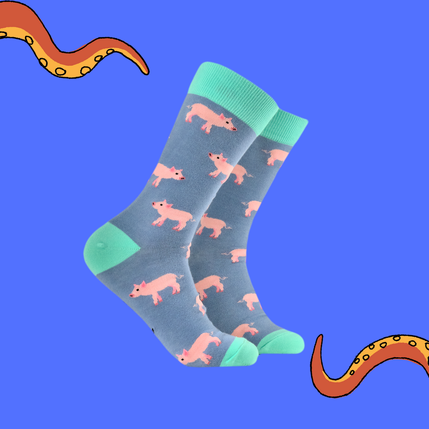 A pair of socks with a pilet motif. Blue legs, green heel, toe and cuff.