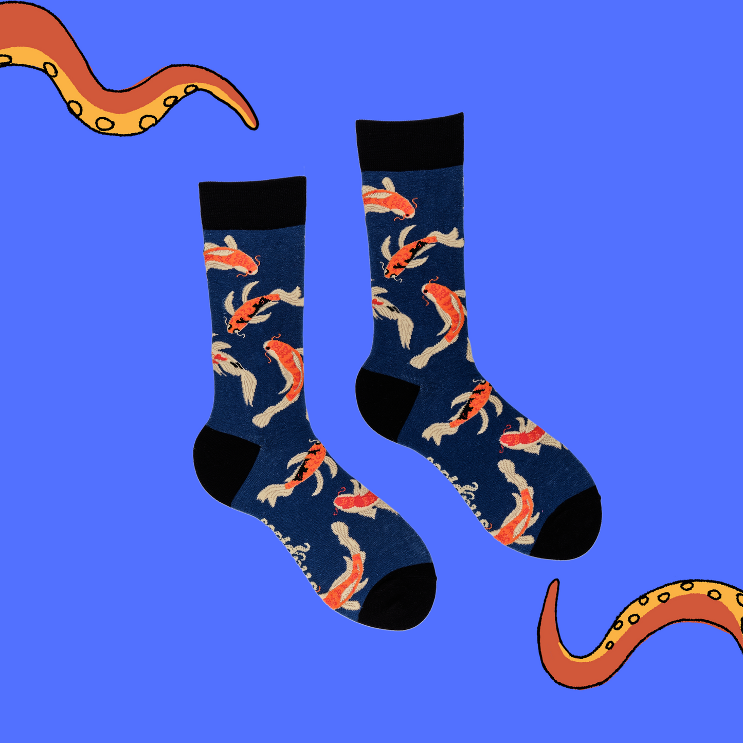 A pair of socks depicting Koi Carp. Dark blue legs, black cuff, heel and toe.