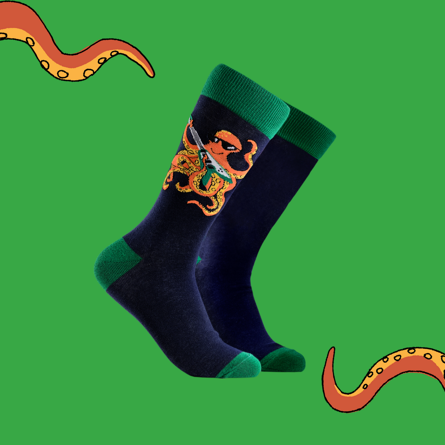 A pair of socks depicting an octopus playing a pink guitar. Dark blue legs, green cuff, heel and toe.