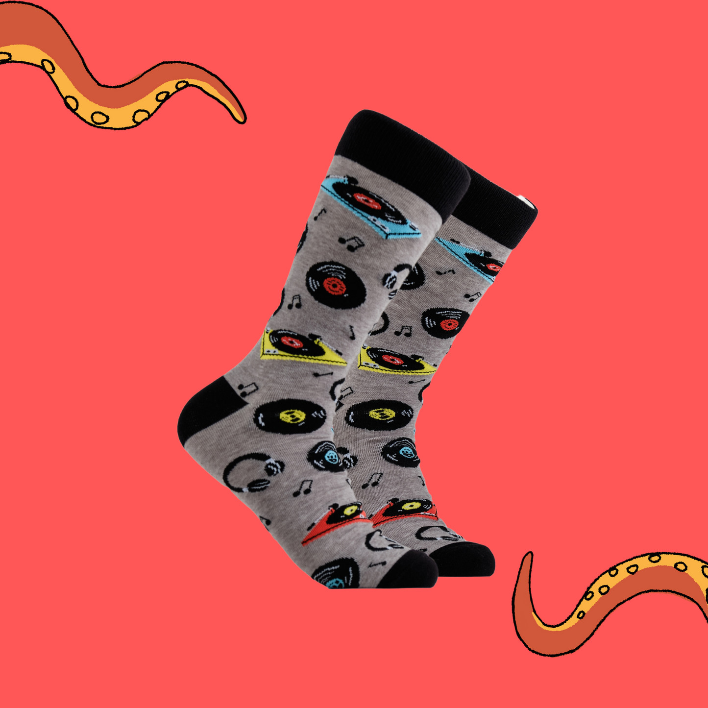 A pair of socks vinyl records and record players. Grey legs, black cuff, heel and toe.