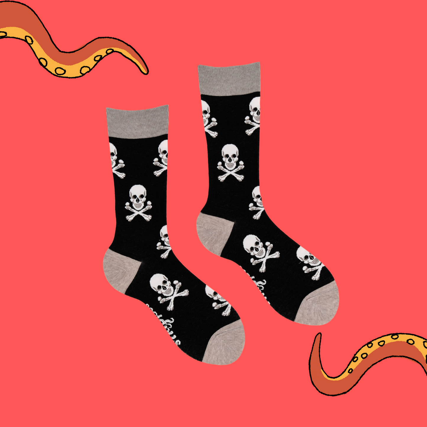 A pair of socks depicting the skull and crossbones. Black legs, grey cuff, heel and toe.