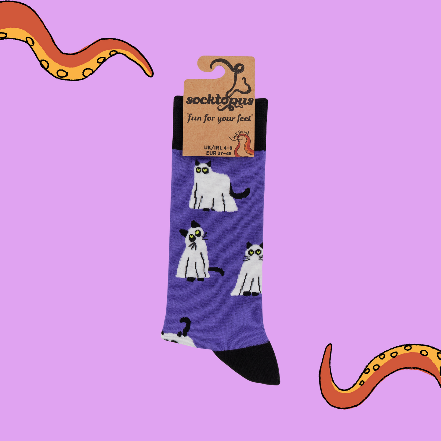 A pair of socks with a glow in the dark, spooky cat motif. Purple legs, black heel toe and cuff.