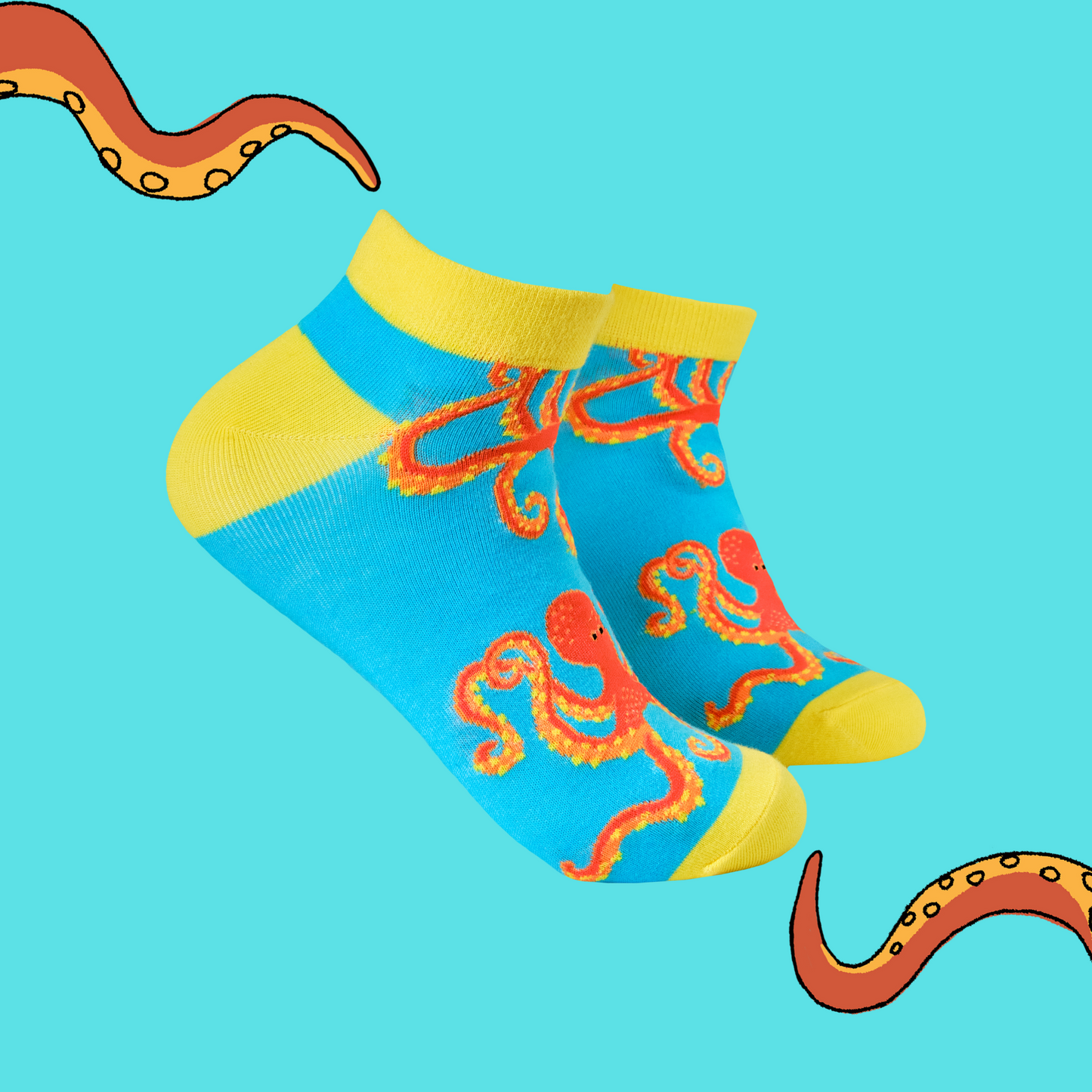 A pair of trainer socks with the soctopus mascot. Blue legs, yellow heel, toe and cuff.
