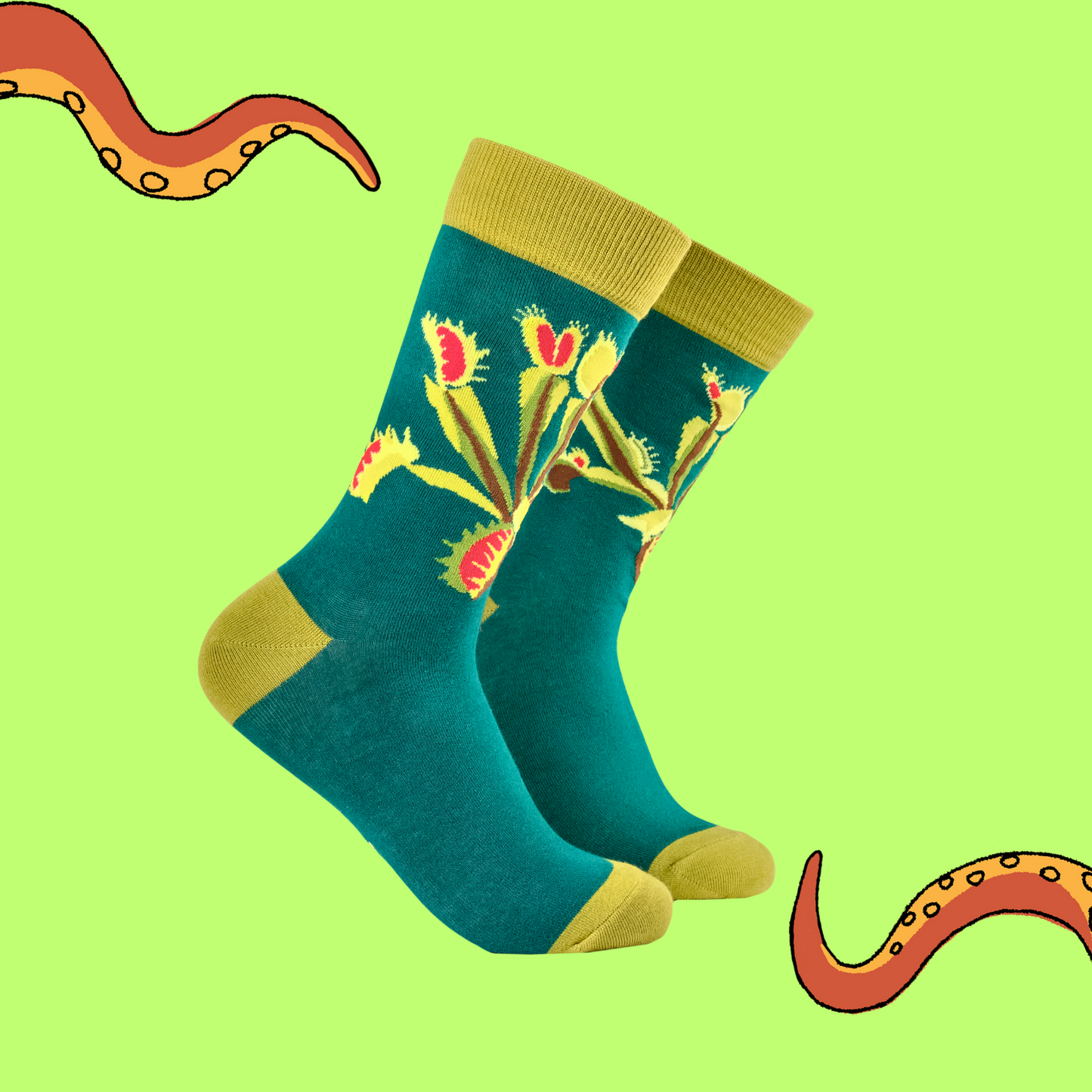 A pair of socks featuring a venus fly trap. Teal legs, yellow heel, toe and cuff.